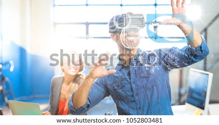 Digital composite of Businessman using VR in office
