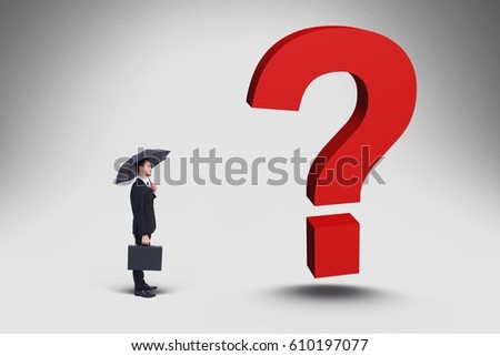 Digital composite of Confused businessman standing in front gigantic 3d question mark