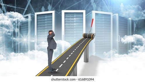 Digital composite of Digitally generated image of confused businessman on highway against servers - Powered by Shutterstock