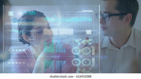 Digital composite of Digitally generated image of icons and graphs with business people in background
