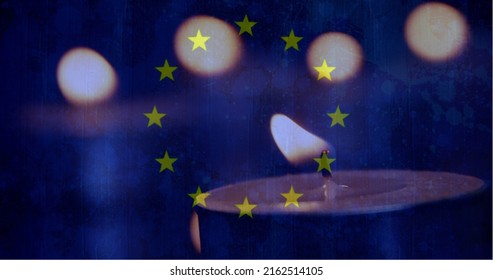 Digital Composite Of European Flag With Candles In The Background. One Candle Going Out 