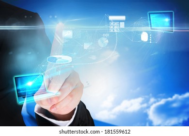 Digital composite of finger pointing to data interface