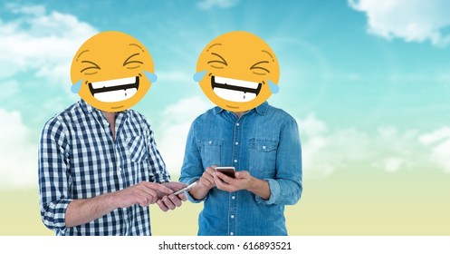 Digital composite of Digital composite of friends with laughing emojis on faces using smart phones - Powered by Shutterstock