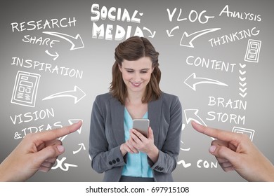 Digital Composite Of Hands Pointing At Happy Business Woman Using Her Phone Against Grey Background With Social Media Ico