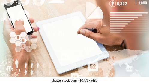 Digital composite of Hands touching blank screens of mobile phone and tablet PC - Powered by Shutterstock