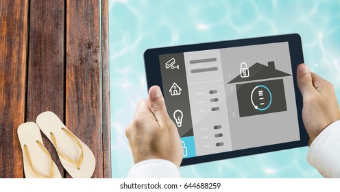 Digital composite of Hands using smart home app at poolside