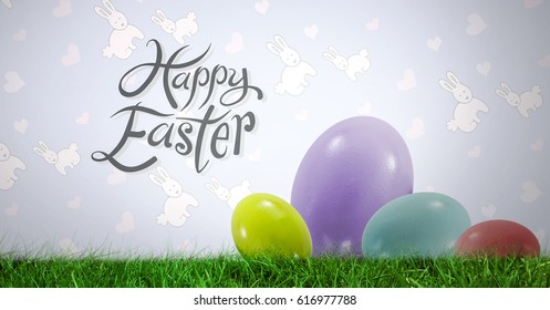 Digital composite of Happy Easter text with Easter eggs in front of pattern