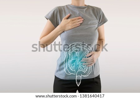 Digital composite of highlighted blue healthy intestine of woman / health care & medicine concept