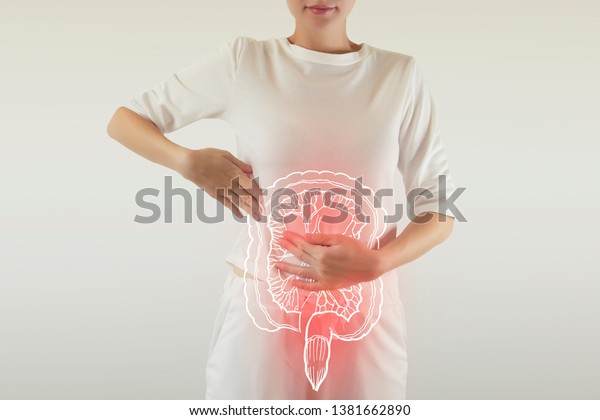 Digital composite of\
highlighted red painful intestine of woman / health care &\
medicine concept