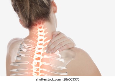 Digital composite of Highlighted spine of woman with neck pain - Shutterstock ID 286003370