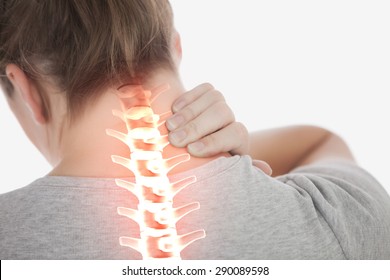 Digital composite of Highlighted spine of woman with neck pain