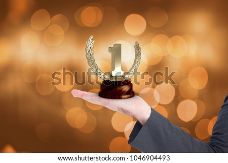 Digital composite of holding trophy