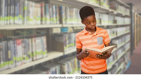 Digital composite image of african american elementary boy reading book while standing in library. copy space, education, learning, library and world book day. - Shutterstock ID 2124104375