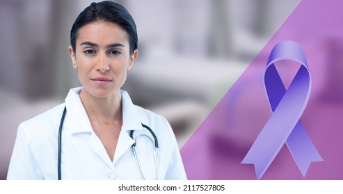 Digital composite image of blue awareness ribbon and confident biracial mid adult female doctor. copy space, world cancer day, portrait, alertness, stethoscope, awareness and hospital concept. - Powered by Shutterstock
