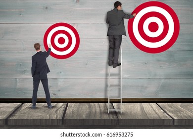Digital composite of Digital composite image of businessman setting targets on wall - Shutterstock ID 616953275