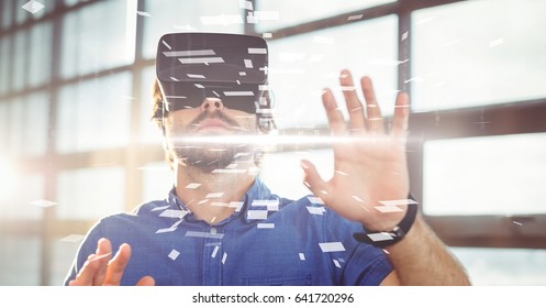 Digital composite of Digital composite image of businessman wearing VR glasses