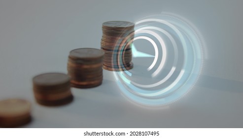 Digital Composite Image Of Digital Clock Ticking Against Multiple Stack Of Coins. Finance And Economy Concept