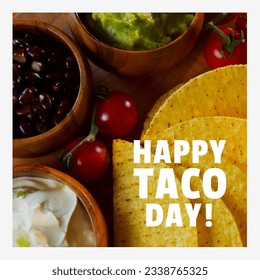 Digital composite image of fresh taco ingredients on table with happy taco day text. Celebration, holiday, mexican food, promotes consumption of tacos concept. - Powered by Shutterstock