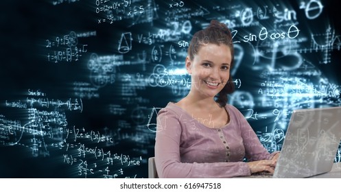 Digital Composite Of Digital Composite Image Of Woman Using Laptop With Math Equations In Background