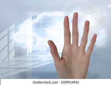 Digital composite of Long Hand open with bright window clouds background