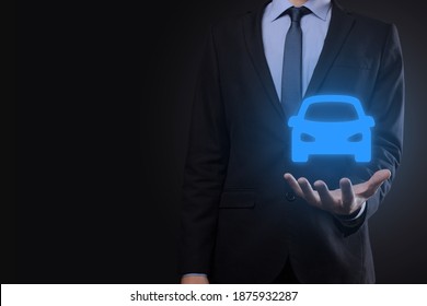 Digital Composite Of Man Holding Car Icon.Car Automobile Insurance And Car Services Concept. Businessman With Offering Gesture And Icon Of Car