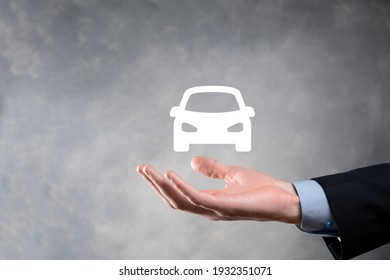 Digital Composite Of Man Holding Car Icon.Car Automobile Insurance And Car Services Concept. Businessman With Offering Gesture And Icon Of Car.