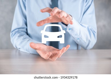 Digital Composite Of Man Holding Car Icon.Car Automobile Insurance And Car Services Concept. Businessman With Offering Gesture And Icon Of Car