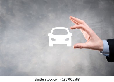 Digital Composite Of Man Holding Car Icon.Car Automobile Insurance And Car Services Concept. Businessman With Offering Gesture And Icon Of Car.