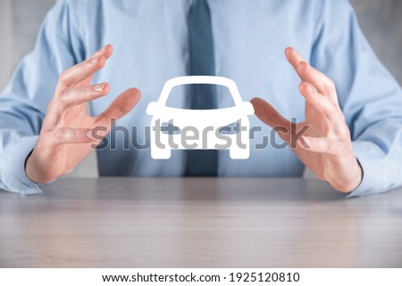 Digital composite of Man holding car icon.Car automobile insurance and car services concept. Businessman with offering gesture and icon of car Сток-фото © 
