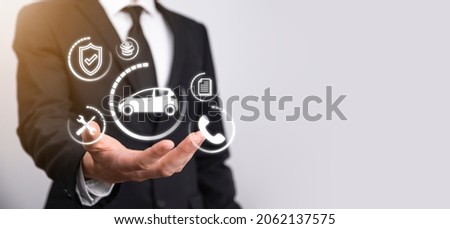 Digital composite of Man holding car icon.Car automobile insurance and car services concept. Businessman with offering gesture and icon of car. Сток-фото © 