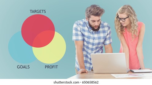 Digital Composite Of Man And Woman At Laptop And Ven Diagram Against Blue Background