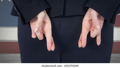 Digital composite of Midsection of businesswoman crossing fingers with American flag in background - Powered by Shutterstock