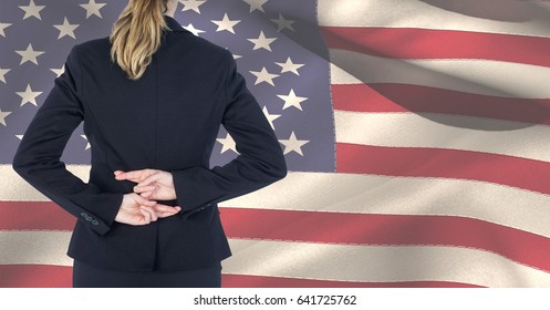 Digital composite of Midsection of female professional crossing fingers against American flag - Powered by Shutterstock