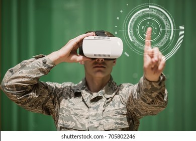 Digital composite of Military man in VR headset touching interface - Powered by Shutterstock