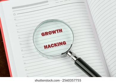 Digital composite, multiple exposure, coding, networking, technology and network server concept. GROWTH HACKING on a blank page of a business notebook through a magnifying glass. - Powered by Shutterstock - Get 15% off with code: PIKWIZARD15