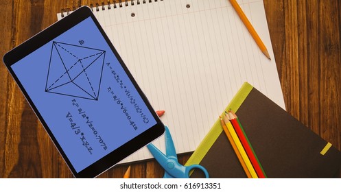 Digital Composite Of Overhead View Of Diagram With Formula In Digital Tablet On Book At Table