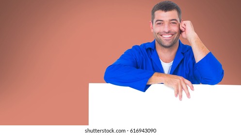 Digital composite of Portrait of worker leaning on blank bill board - Powered by Shutterstock