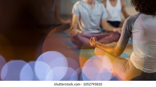 Digital composite of Rear view of instructor teaching meditation to customers - Powered by Shutterstock