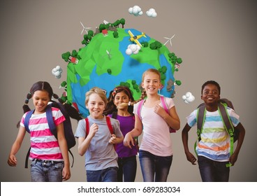 Digital composite of Running kids with planet earth world over blank brown background