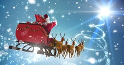 Digital Composite Of Santa Flying In Sleigh With Christmas Sky