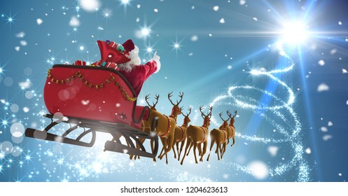 Digital composite of Santa flying in sleigh with Christmas sky - Powered by Shutterstock