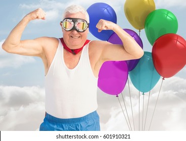 Digital Composite Of Strong Old Man With Balloons Against A Sky Background