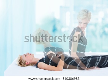 Digital composite of Woman Meditating astral projection out of body experience by window