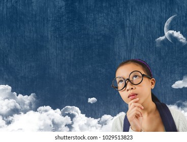 Digital Composite Of Young Girl Looking Up At Cloudy Sky With Moon