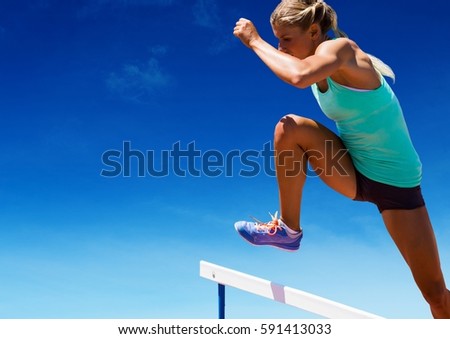 Digital composition of athlete jumping over hurdles against sky in background