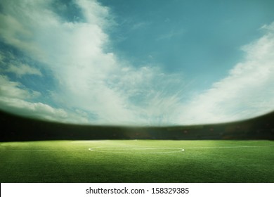 Digital Composition Of Soccer Field And Blue Sky