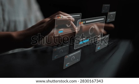 Digital Concept of Data Loading with User Hand Typing on Keyboard Surrounded by Floating Browser Windows with Loading Icons in Dark Background Gluon.