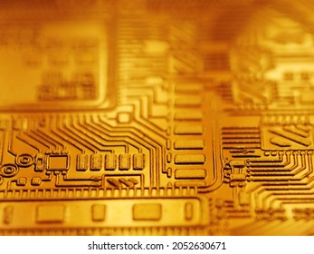 Digital currency bitcoin coin golden computer circuit board background, closeup
