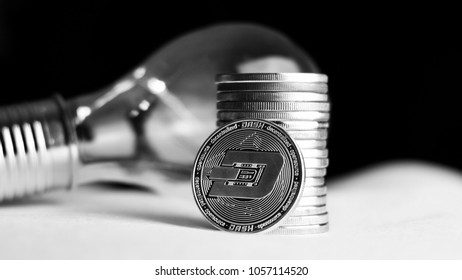 Digital currency physical metal silver dashcoin coin. Cryptocurrency concept.