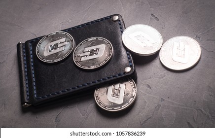 Digital currency physical metal silver dashcoin coin. Cryptocurrency concept.